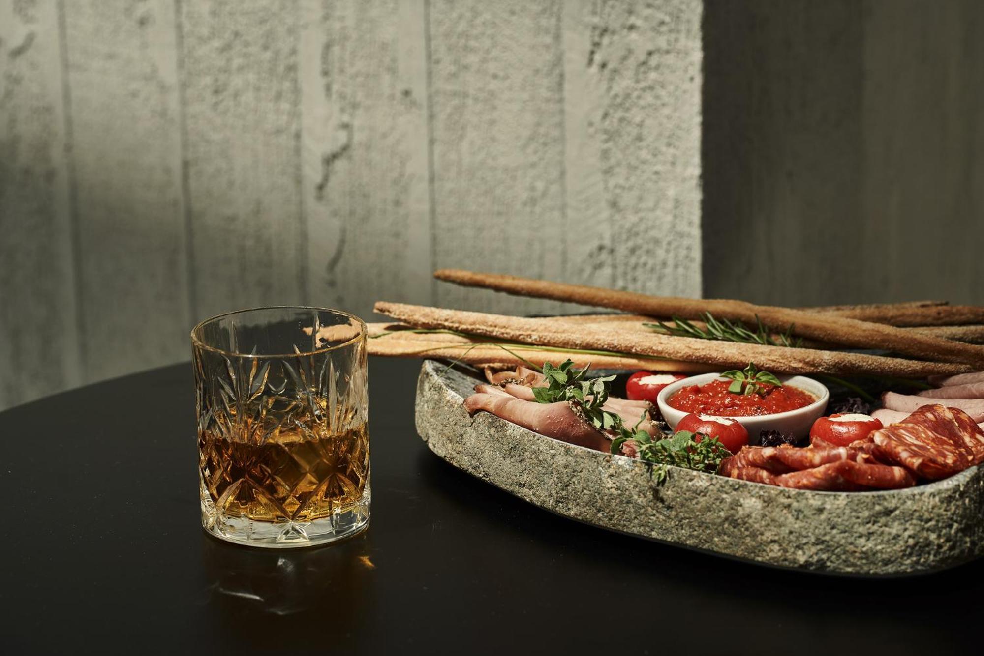 The Newel Psychiko Hotel Athena Bagian luar foto A glass of grappa